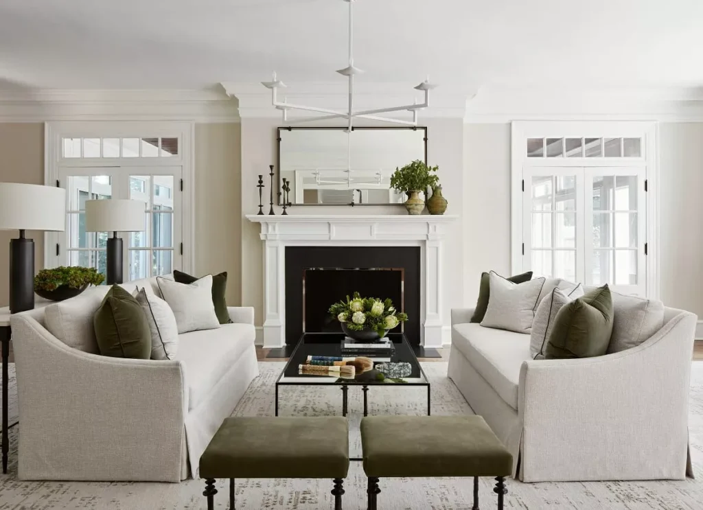 A living room with white and olive hues