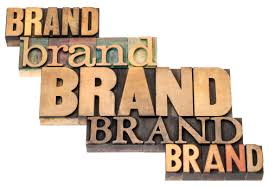 The word brand is written in wood type on a white background.