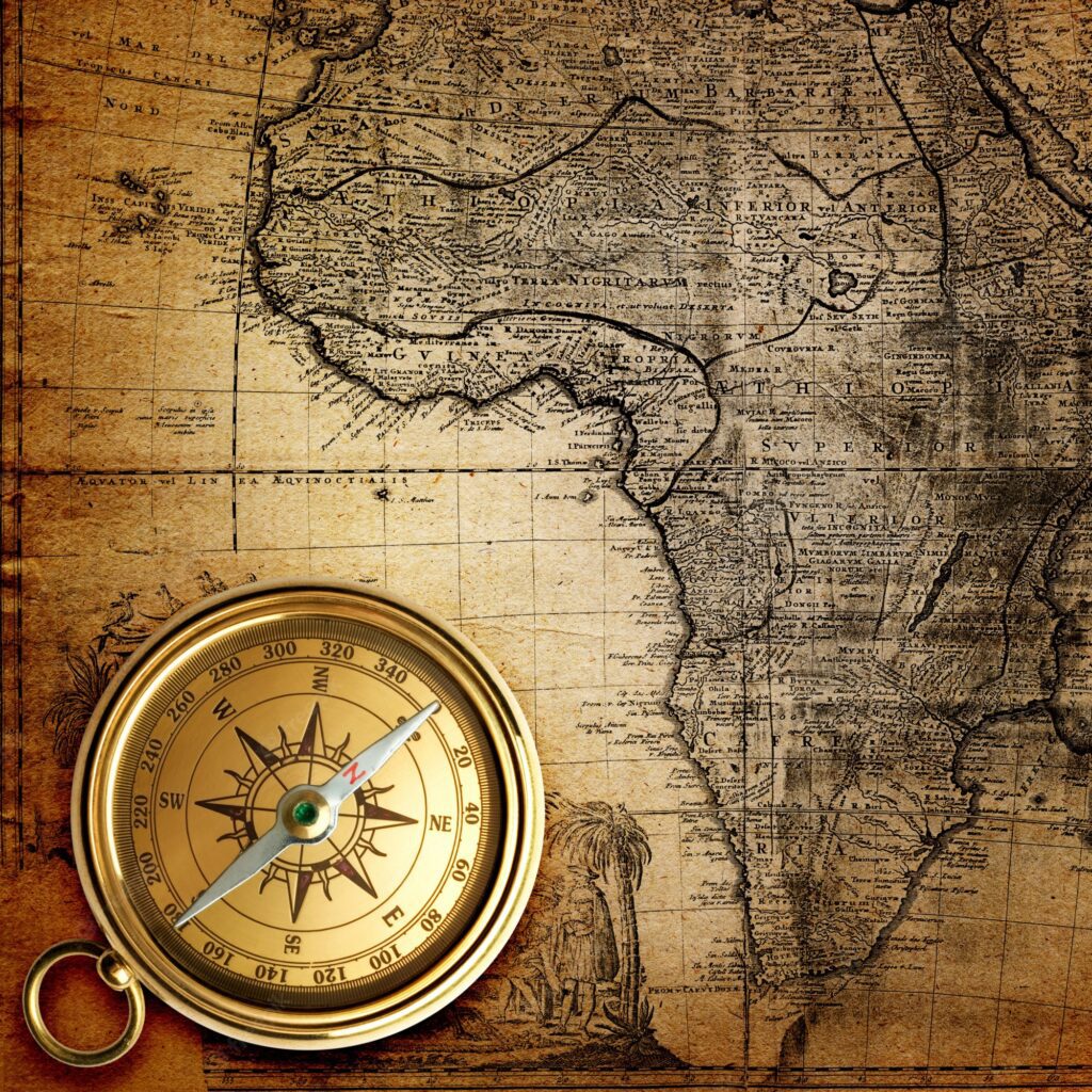 An old compass on an old map.