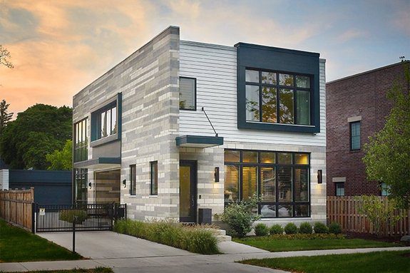 The exterior of a modern home at dusk.