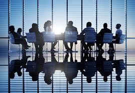 A group of people sitting at a table.